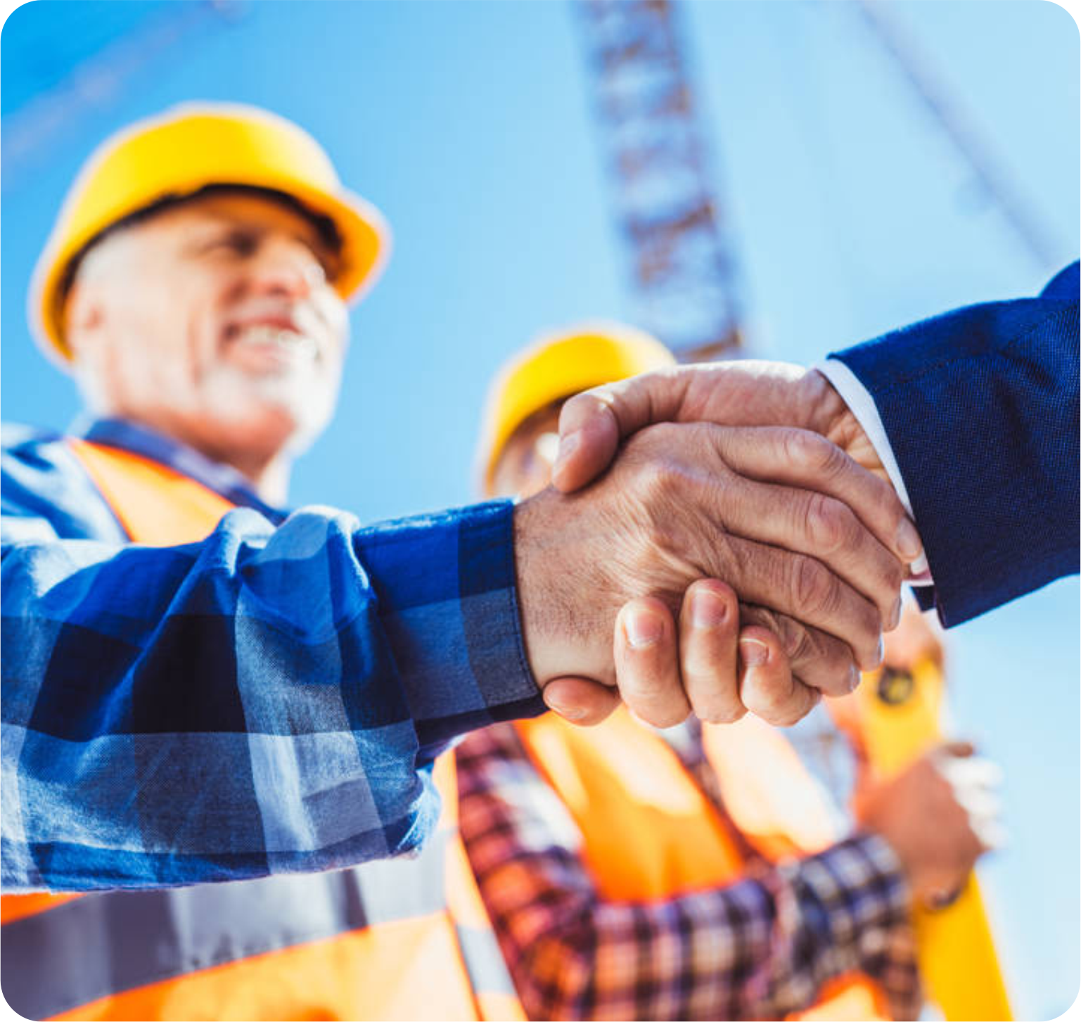 Two construction professionals shaking hands